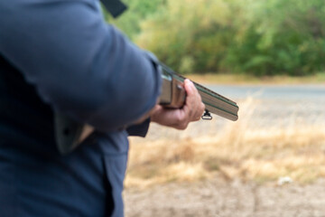 Male hunter ready to hunt with hunting rifle.hunter Holds a rifle.