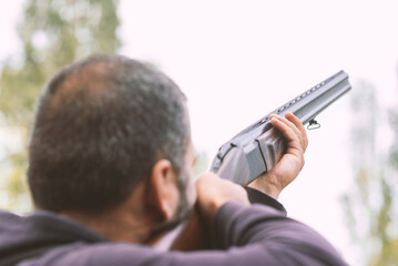 Male hunter ready to hunt with hunting rifle.hunter Holds a rifle.