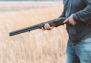 Male hunter ready to hunt with hunting rifle.hunter Holds a rifle.