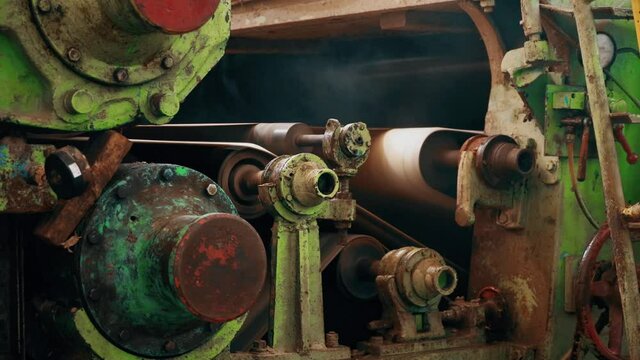 Old Manufactoring equipment Produce Paper Machine Shafts At Paper Mill. equipment. Paper Production. rolling rolls