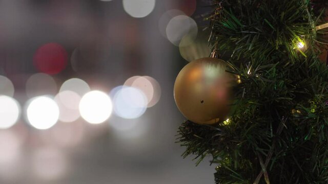 Christmas ball on pine tree branch blurred bokeh night scene merry x ams happy new year concept