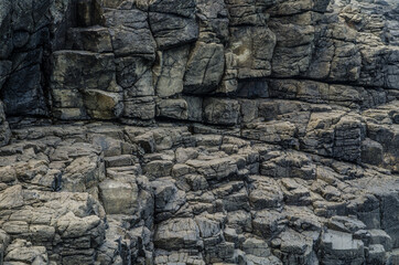 Grey coastal rock wall pattern.