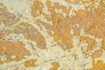 Yellow Natural stone surface with abstract pattern.