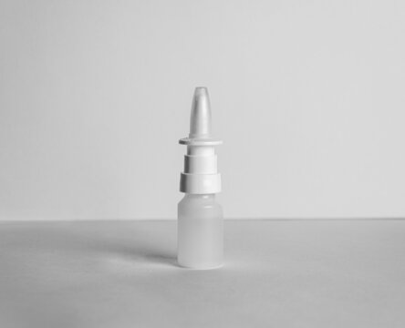Nasal spray mockup. Frosted plastic bottle with blank label.