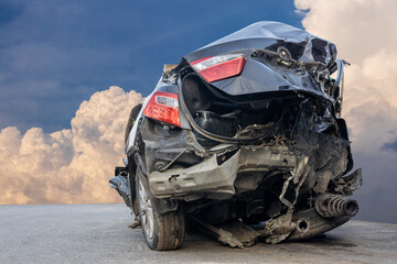 The wreckage of the rear of a black sedan smashed into wreckage until it turned into scrap metal.