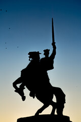 Fototapeta na wymiar King raising sword on prancing horse - statue silhouette on Bratislava Castle