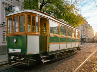 Fototapeta na wymiar Vintage tram in green paint in historic centre of Bratislava, Slovakia