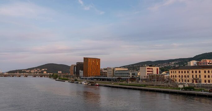 Sunset in Drammen southern Norway with the station and new building at the waterfront