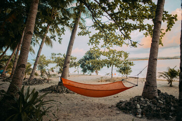 Fototapeta na wymiar hammock on the beach in philippines