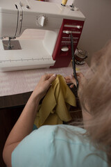 seamstress works at home in quarantine