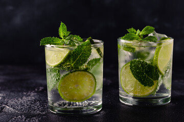 Refreshing summer alcoholic cocktail mojito with ice, fresh mint and lime