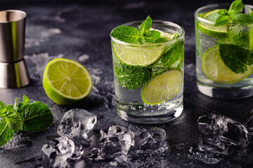 Refreshing summer alcoholic cocktail mojito with ice, fresh mint and lime