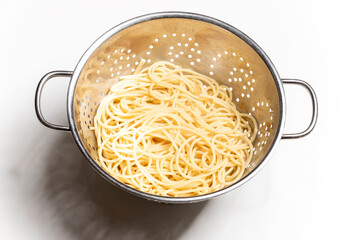 spaghetti pasta in a colander