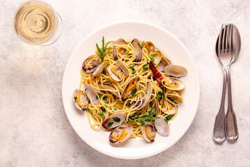 Seafood pasta with clams Spaghetti alle Vongole on a light background