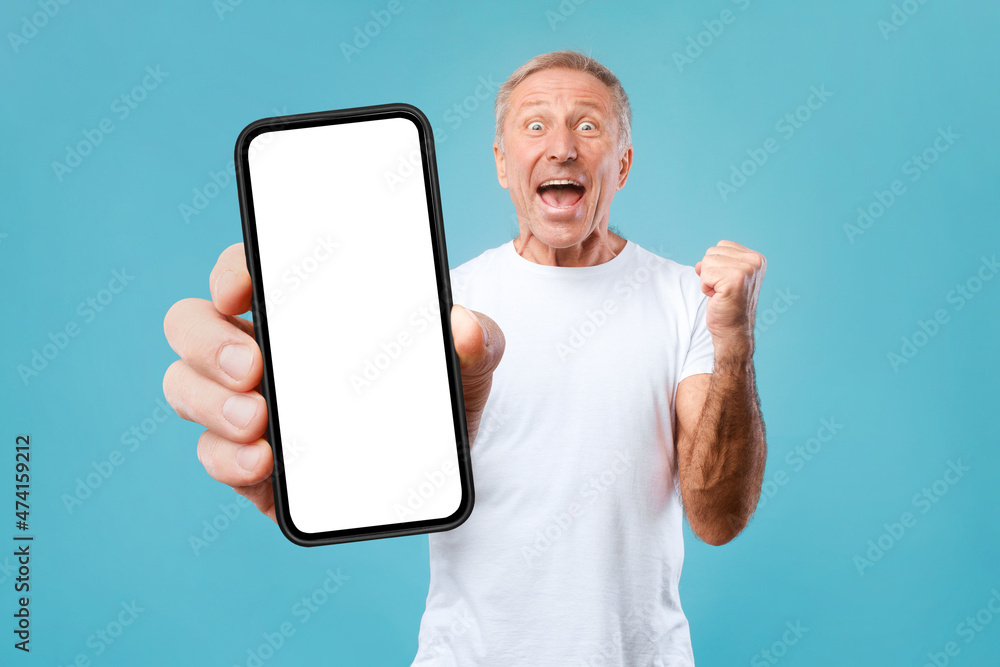Poster excited guy leaning on empty smartphone screen and gesturing yes