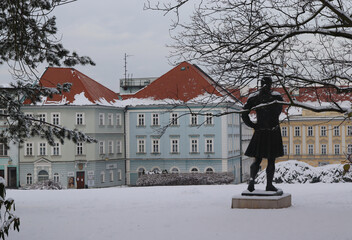 Spa square in the town of Teplice with a statue of Mozart in the snow