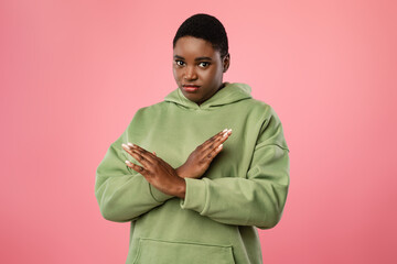 Displeased Overweight Black Woman Crossing Hands Gesturing Stop, Pink Background