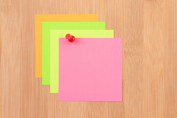 Colored Sticky Notes with Copyspace Pinned to the Wooden Message Board. To Do List Reminder in Office. Blank Memo Sticker at Work - Template. Empty Checklist - Mockup