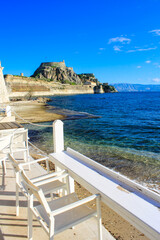 Corfu Castle old fort Greek island surrounded by blue sea sky and mountains a tourist attraction in Mediterranean Greece.