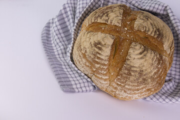 Obraz premium Whole Wheat Sourdough Bread on White Background