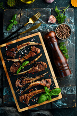 Roasted lamb ribs with sauce. Meat. Top view. Free copy space.