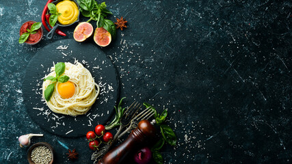 Fototapeta na wymiar Paste. carbonara with egg yolk. Top view. Italian food. Free space for your text.