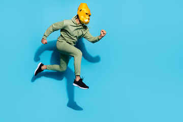 Fototapeta na wymiar Profile photo of charismatic guy jump jogging wear gorilla mask sportswear isolated blue color background