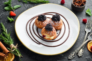 Eclairs with poppy seeds and cream. Top view. Free space for text.