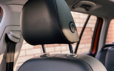 Close-up of a car seat headrest. Photography of the car interior