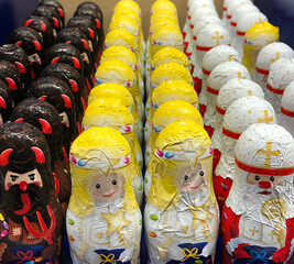 Rows of chocolate devils, angels and the pope