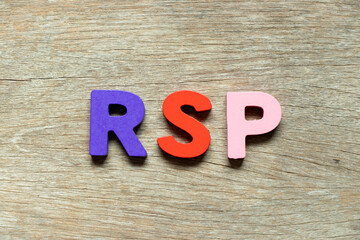 Color alphabet letter in word RSP (Abbreviation of Retail  selling price, Retirement savings plan or Research and sponsored programs) on wood background