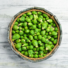 Brussels sprouts in a wooden box. Healthy food. Fresh vegetables. Top view.