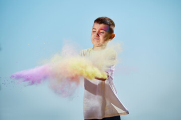 happy little child girl throw bright paints