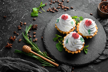 Sweet baskets of cake with creamy filling. Sweet pastries and dessert. Top view.