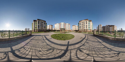 360 hdri panorama in middle of modern multi-storey multi-apartment residential complex of urban...