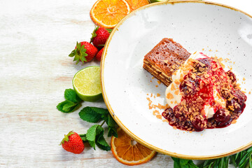 A piece of cake with fruit and cream. Top view. Free space for text.