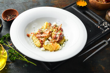 Potato sticks with bacon and cheese. Restaurant menu. Top view.