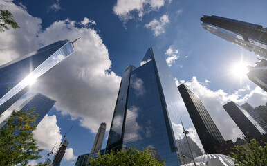 One World Trade Center skyscraper office building in Manhattan, New York, in a sunny day with blue sky and amazing reflections. One of the best sights and landmarks in America.