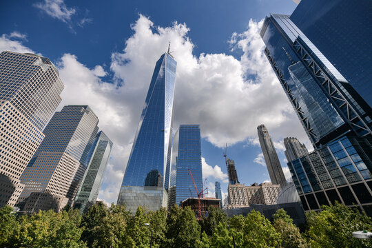 One World Trade Center skyscraper office building in Manhattan, New York, in a sunny day with blue sky and amazing reflections. One of the best sights and landmarks in America.
