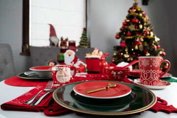 Christmas background. Christmas tableware and decorations on the table.