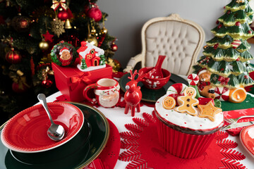 Christmas background. Christmas tableware and decorations on the table.