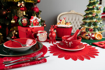 Christmas background. Christmas tableware and decorations on the table.