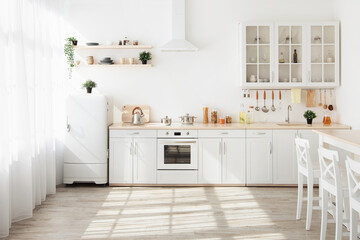 Kitchen with light walls, white furniture and small refrigerator in dining room scandinavian design - obrazy, fototapety, plakaty