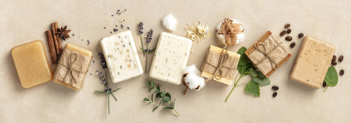Natural soap bars and ingredients on beige background, flat lay - obrazy, fototapety, plakaty