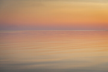 Beautiful sunset over Baltic sea. Natural background. Estonia. Afterglow, evening calm on the Sea.