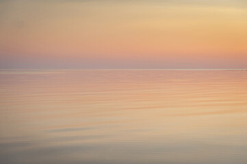 Fototapeta premium Beautiful sunset over Baltic sea. Natural background. Estonia. Afterglow, evening calm on the Sea.