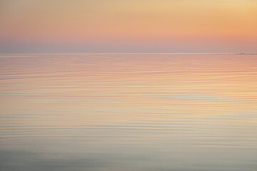 Beautiful sunset over Baltic sea. Natural background. Estonia. Afterglow, evening calm on the Sea.
