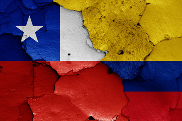 flags of Chile and Colombia painted on cracked wall