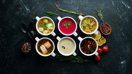 Set of soups. Meat soup, fish soup, chicken soup. Dishes, food. Top view. Free space for your text.