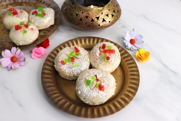 Rasmalai or Malai Sandwich, Roshmolai, Rasamalei is very popular Indian dessert. A sweet malai stuffing inside Rasgulla. It's a sweet delicacy made with Indian cottage cheese or chenna. Copy space.